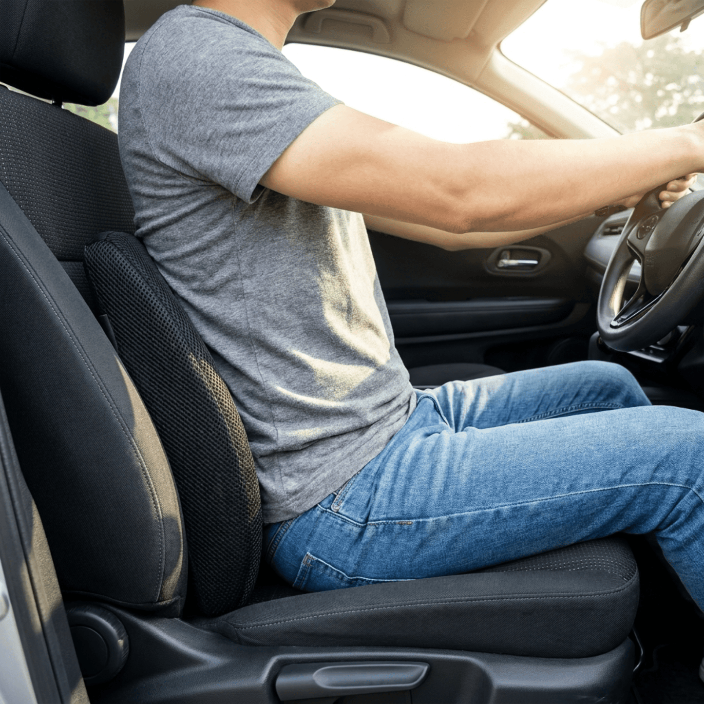 Memory Foam Lumbar Support Cushion — placed on a car seat providing support to the driver